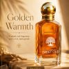 Scent Luxe Sweet Oud perfume bottle with gold spherical cap and amber liquid on a warm golden background
